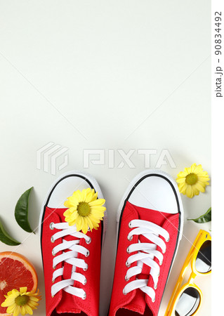 Summer clothes concept with sneakers on white background 90834492