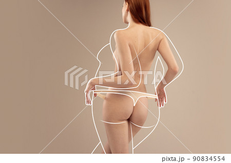 Cropped back view image of slender female body in underwear isolated over beige background. Line art over body Cropped back view image of slender female body in underwear isolated over beige background. Line art over body 90834554