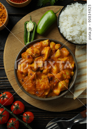 Concept of tasty food with chicken tikka on wooden background Concept of tasty food with chicken tikka on wooden background 90834925