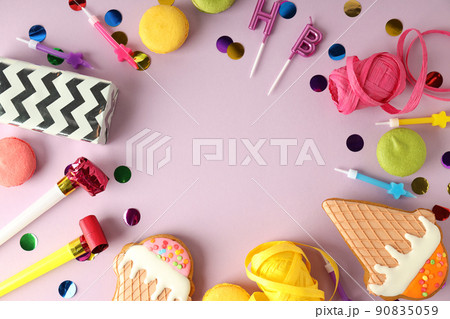 Birthday accessories on light violet background, space for text 90835059