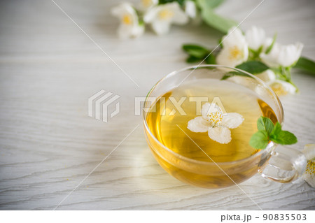 Composition with cup of jasmine tea and flowers 90835503