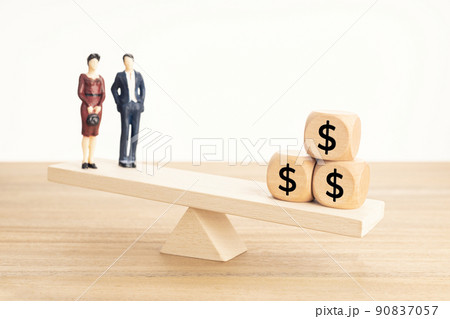 Life and Work or money balance concept. Couple figurine and dollar symbol on wooden blocks on wooden seesaw Life and Work or money balance concept. Couple figurine and dollar symbol on wooden blocks on wooden seesaw 90837057