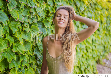 Woman tourist walking in Montenegro. Panoramic summer landscape of the beautiful green Royal park Milocer on the shore of the the Adriatic Sea, Montenegro Woman tourist walking in Montenegro. Panoramic summer landscape of the beautiful green Royal park Milocer on the shore of the the Adriatic Sea, Montenegro 90837644