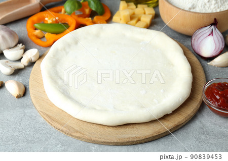 Concept of cooking pizza on gray textured background 90839453