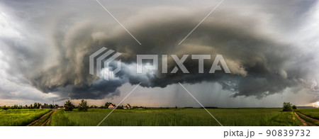 Storm clouds over field, extreme weather, dangerous storm 90839732