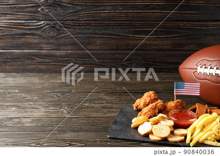Concept of Super bowl snacks on dark table Concept of Super bowl snacks on dark table 90840036