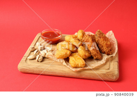 Concept of Super bowl snacks on red background Concept of Super bowl snacks on red background 90840039
