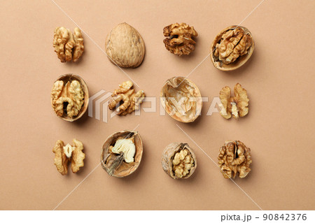 Flat lay composition with walnuts on brown background 90842376