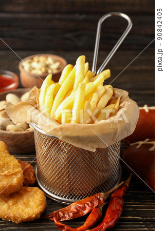 Concept of Super bowl snacks on dark table Concept of Super bowl snacks on dark table 90842403