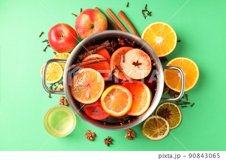 Concept of cooking  mulled wine on green background 90843065