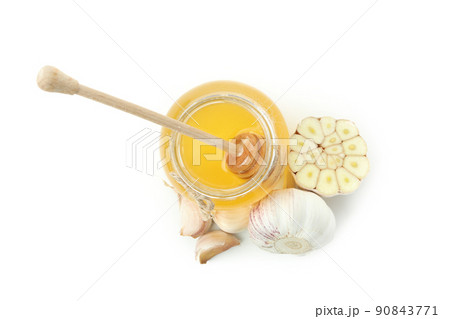 Concept of treatment colds with honey and garlic isolated on white background Concept of treatment colds with honey and garlic isolated on white background 90843771