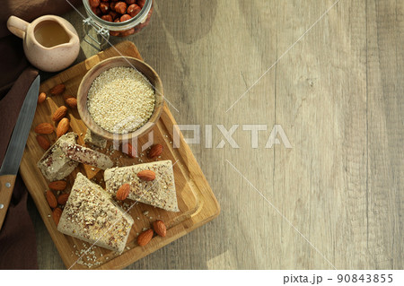 Concept of tasty food with halva on wooden background 90843855