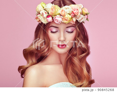 Beautiful blonde woman with flower wreath on her head Beautiful blonde woman with flower wreath on her head 90845268