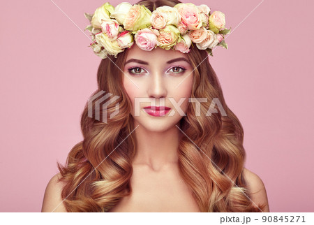 Beautiful blonde woman with flower wreath on her head 90845271