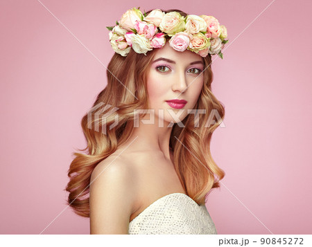Beautiful blonde woman with flower wreath on her head 90845272