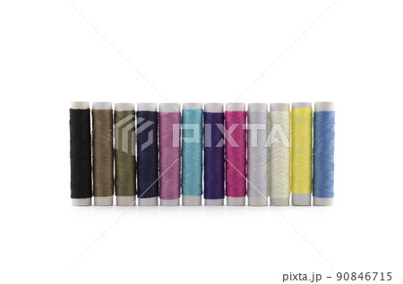 Colourful thread spools on white background with clipping path 90846715