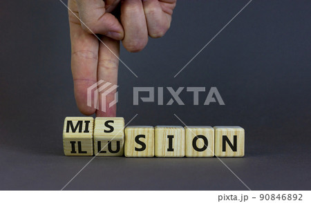 Mission or illusion symbol. Businessman turns wooden cubes and changes the word 'mission' to 'illusion'. Beautiful grey table, grey background, copy space. Business and mission or illusion concept. 90846892
