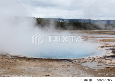 Hot spring Geyser with colorful water in American Landscape. Hot spring Geyser with colorful water in American Landscape. 90847765