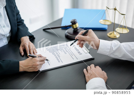 Male lawyer or notary working consulting and discussion to businesswoman client in the office, Law and Legal services concept Male lawyer or notary working consulting and discussion to businesswoman client in the office, Law and Legal services concept 90858955