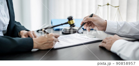 Businesswoman and Male lawyer or judge consult and conference having team meeting with client at law firm in office, Law and Legal services concept 90858957