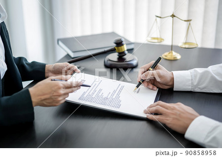 Male lawyer or notary working consulting and discussion to businesswoman client in the office, Law and Legal services concept 90858958