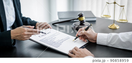 Businesswoman and Male lawyer or judge consult and conference having team meeting with client at law firm in office, Law and Legal services concept 90858959