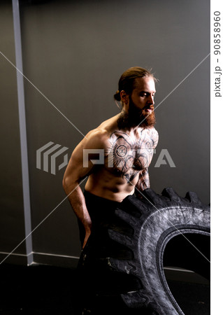 Fitness muscular gym tire wheel flipping male man ABS exercise, concept training weight from fit from huge concentration, effort health. Athletic muscle build, Fitness muscular gym tire wheel flipping male man ABS exercise, concept training weight from fit from huge concentration, effort health. Athletic muscle build, 90858960