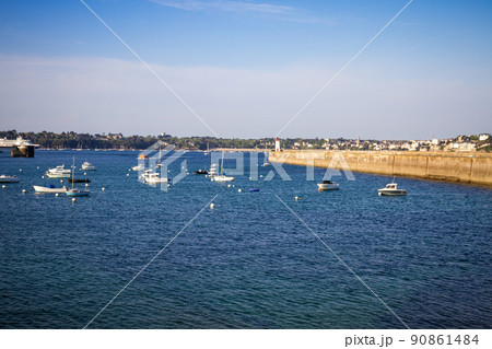 Saint-Malo lighthouse and pier view from the city fortifications, Brittany, France 90861484