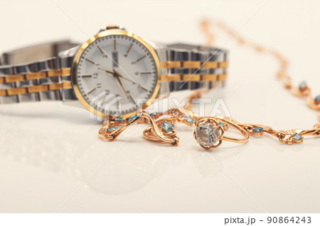 Accessories and jewelry for a fashionable girl : gold ring, necklace and original wristwatch Accessories and jewelry for a fashionable girl : gold ring, necklace and original wristwatch 90864243