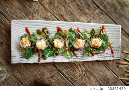 Portion of gourmet baked stuffed mushrooms 90865429