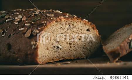 Close-up of homemade whole grain bread crumb with seeds. Selective focus 90865441