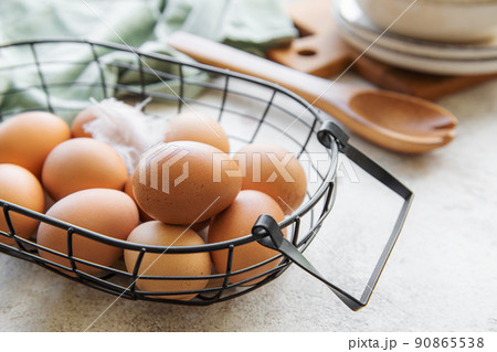 Basket of fresh brown eggs Basket of fresh brown eggs 90865538