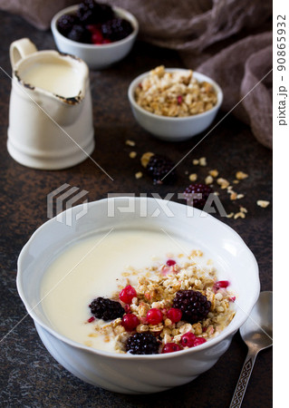 Healthy breakfast. Homemade yoghurt with granola, currant and black raspberries. Healthy breakfast. Homemade yoghurt with granola, currant and black raspberries. 90865932