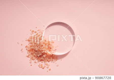 Top view of halit himalaya salt decorated with petri dish in pink background  90867720