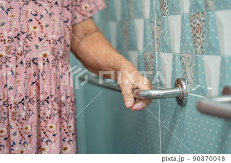 Asian senior or elderly old lady woman patient use toilet bathroom handle security in nursing hospital ward, healthy strong medical concept. Asian senior or elderly old lady woman patient use toilet bathroom handle security in nursing hospital ward, healthy strong medical concept. 90870048
