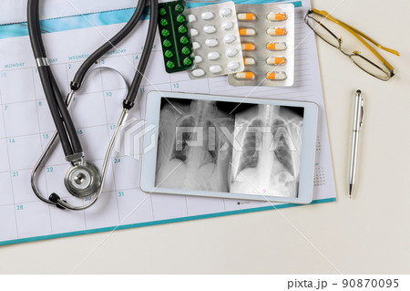 Doctor checks digital monitor on x-ray the correct installation of a pacemaker in office medical Doctor checks digital monitor on x-ray the correct installation of a pacemaker in office medical 90870095
