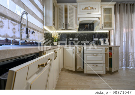 White classic cozy kitchen and dining room in city house 90871047