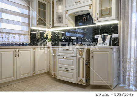 White classic cozy kitchen and dining room in city house 90871048
