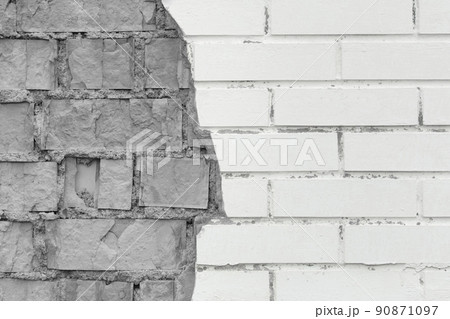 Brick grey broken masonry wall with cement white concrete damaged facade background texture old 90871097