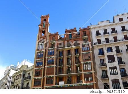 Facade of a building. Residential building with balconies. 90871510