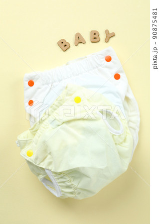 Concept of baby clothes with reusable diapers on light background 90875481