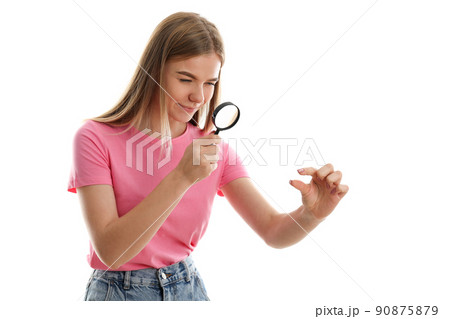 Attractive girl with magnifier isolated on white background 90875879