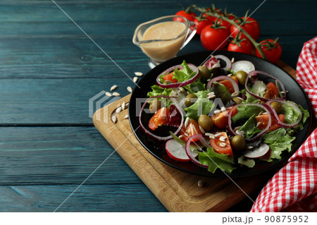 Concept of tasty food with vegetable salad with tahini sauce on wooden background 90875952