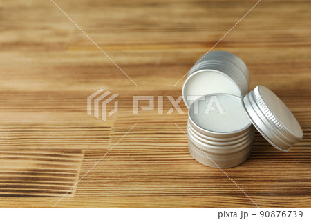Eco lip balm on wooden background, space for text 90876739