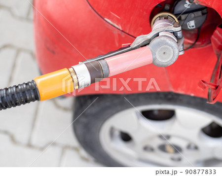 Filling a car with gas 90877833