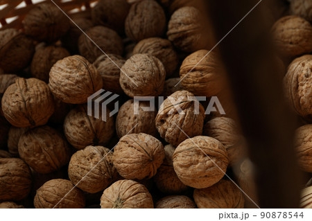 Walnuts with in wicker basket, close up Walnuts with in wicker basket, close up 90878544
