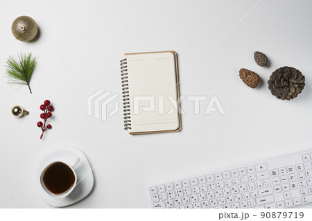 White Christmas, desk office with laptop, decoration and work supplies with cup of coffee. Top view with copy space for input the text. Flat lay desk table winter Christmas. Business Holidays Concept. 90879719