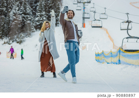 couple taking a selfie in winter couple taking a selfie in winter 90880897