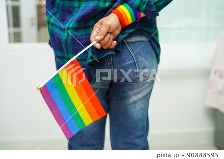 Asian woman with rainbow flag, LGBT symbol rights and gender equality, LGBT Pride Month in June. 90888595