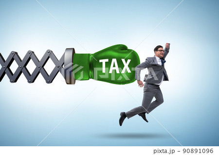 Tax concept with businessman being hit by boxing glove Tax concept with businessman being hit by boxing glove 90891096